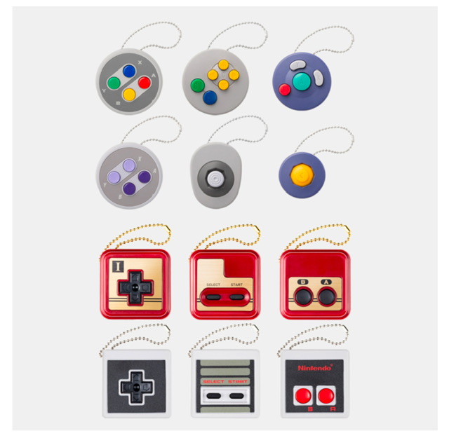 Capture d'écran qui montre douze porte-clés en forme des manettes de 5 consoles différentes
