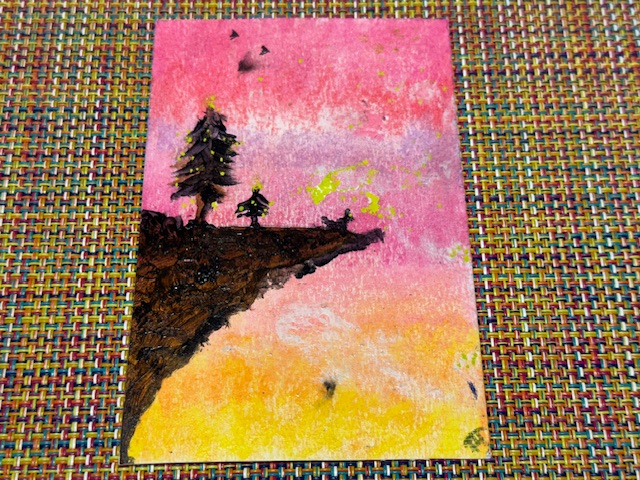 Carte avec un dessin de deux arbres au bord d'une falaise, vers le coucher du soleil