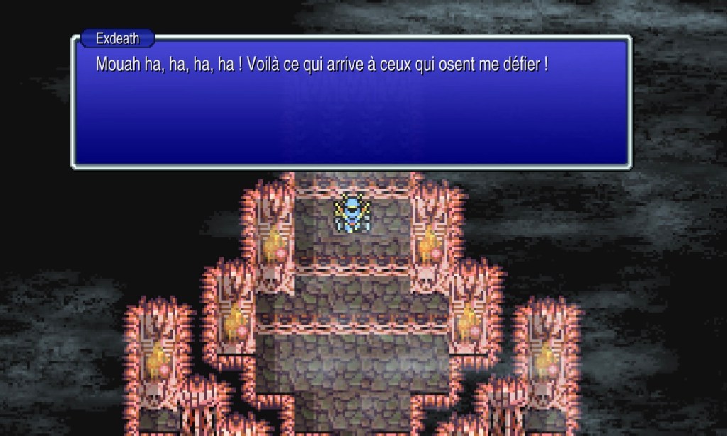 Exdeath, portant une armure bleue claire, reste debout dans son château plein de crânes et de torches, et annonce « Mouah ha ha ! Voilà ce qui arrive à ceux qui osent me défier ! »