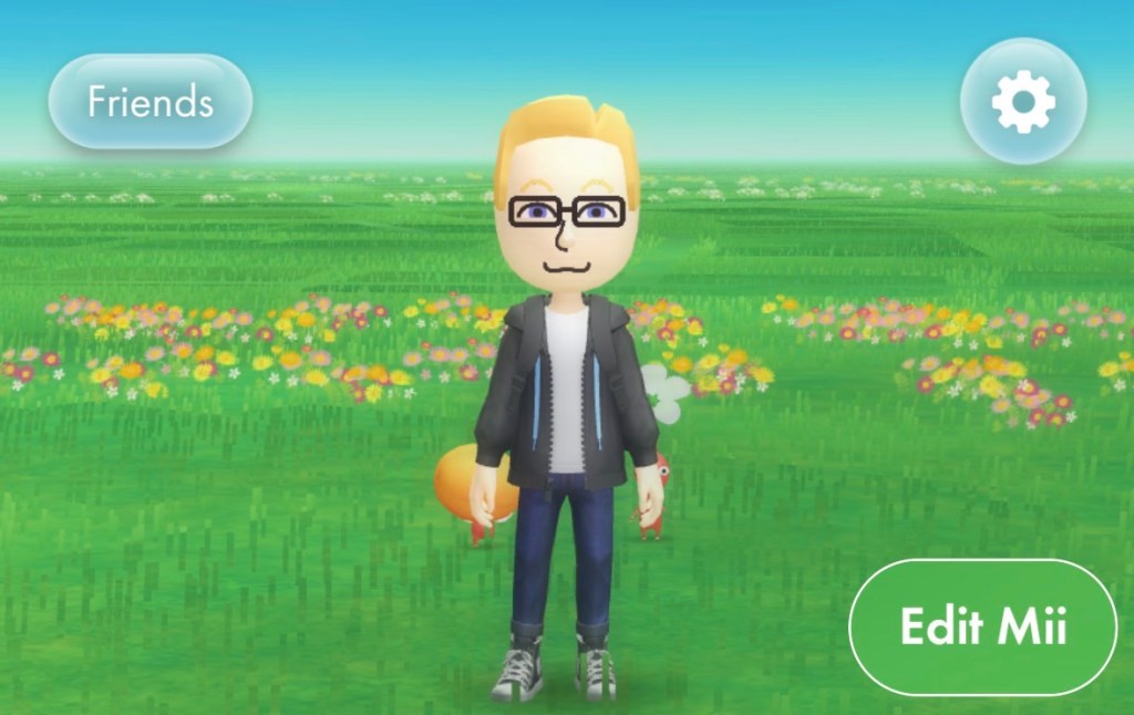 C'est un peu moi, avec plus de cheveux blonds qu'au présent, des lunettes rectangulaires, une veste noir, une chemise blanche et un jean bleu. 