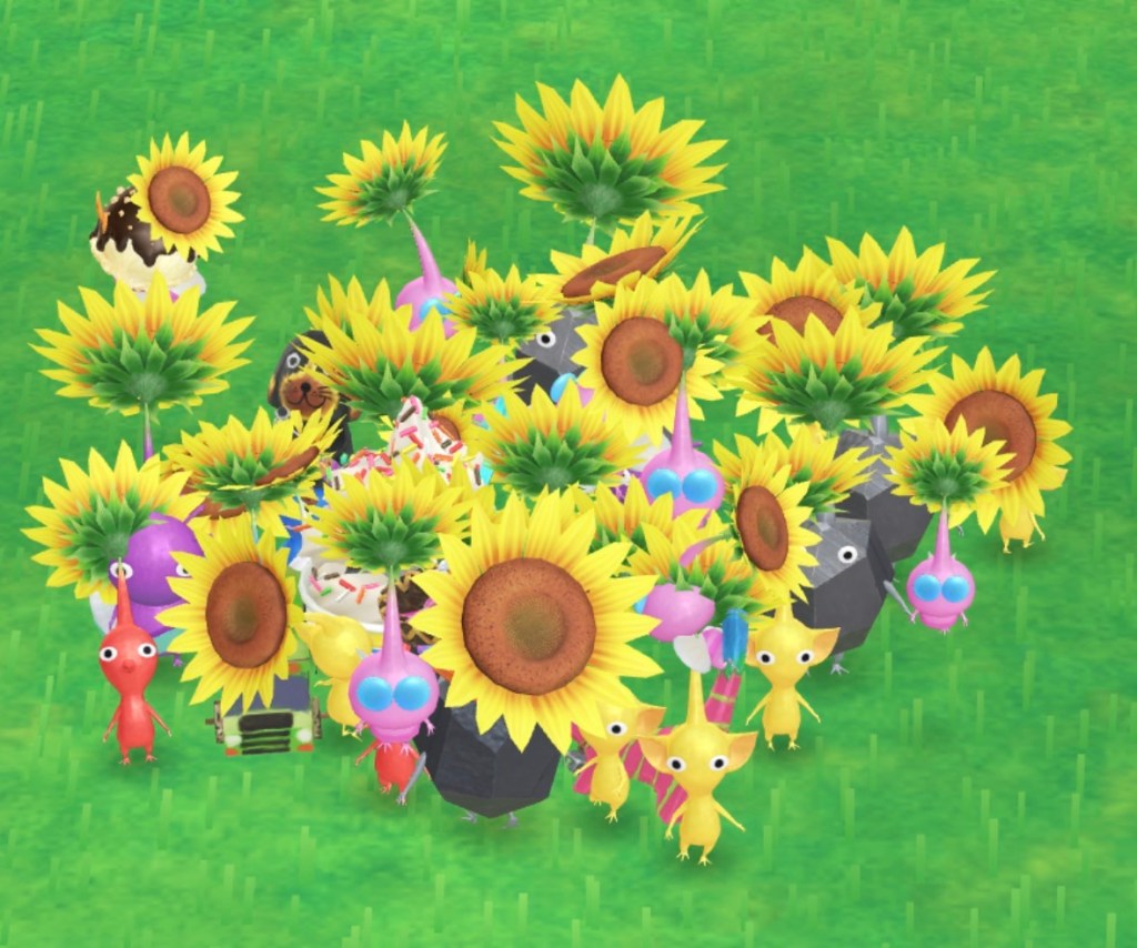 Capture d'écran d'une trentaine de Pikmins avec des tournesols sur la tête.