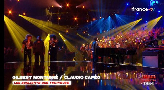 Gilbert Montagné au piano -- M. Capéo chante debout à gauche